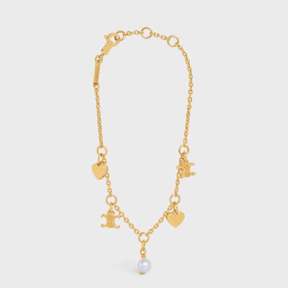 Close-up of Celine Women Cœur Celine Charms Bracelet gold finish and resin pearl