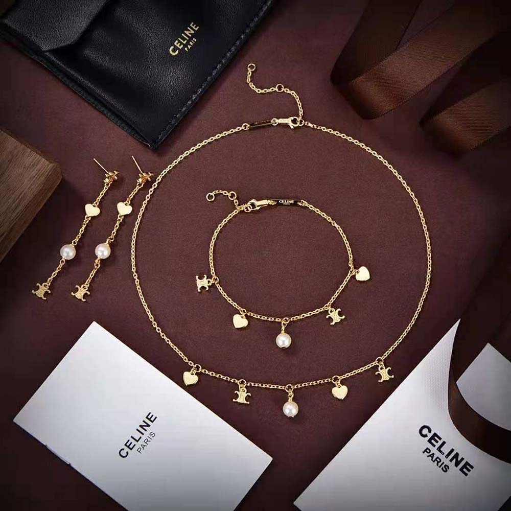 Side view of Celine Women Cœur Celine Charms Necklace with resin pearl