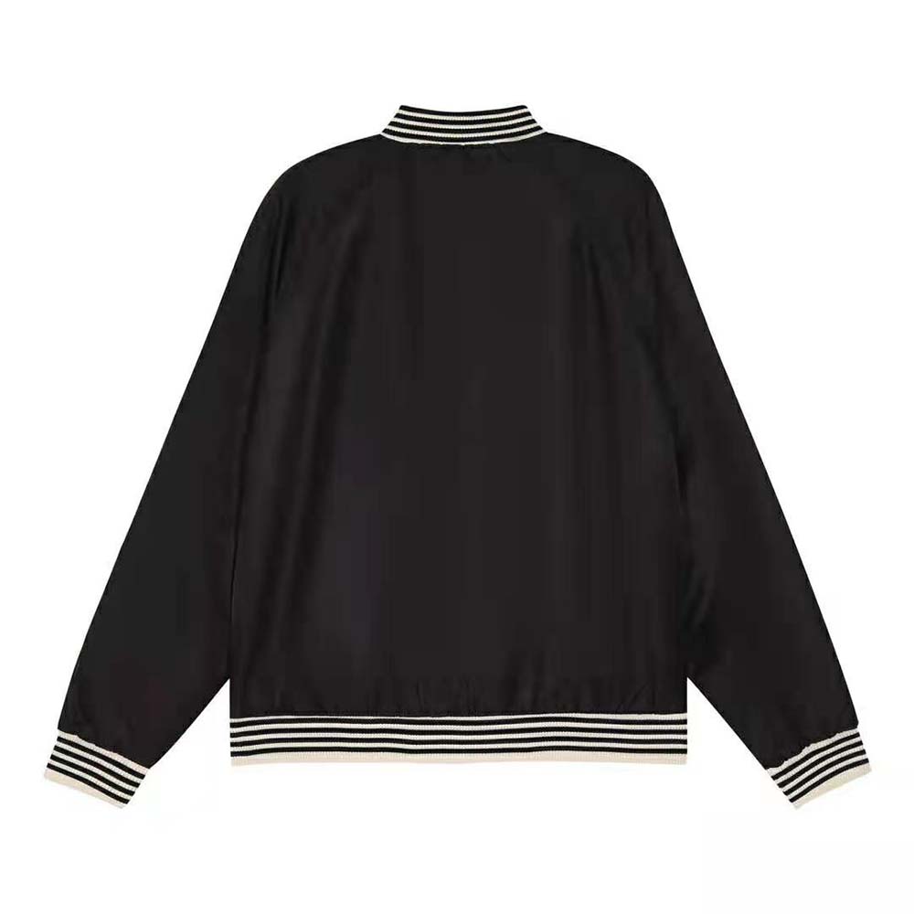 Side angle showing relaxed silhouette and fabric texture of Celine embroidered jacket