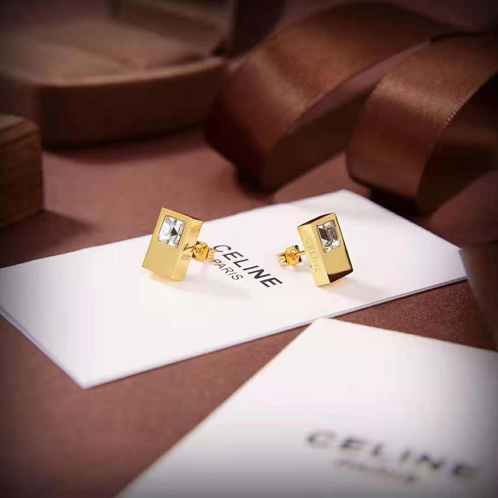 Pair of Celine Women Sentimental Double Square Stud in yellow gold displayed on velvet
