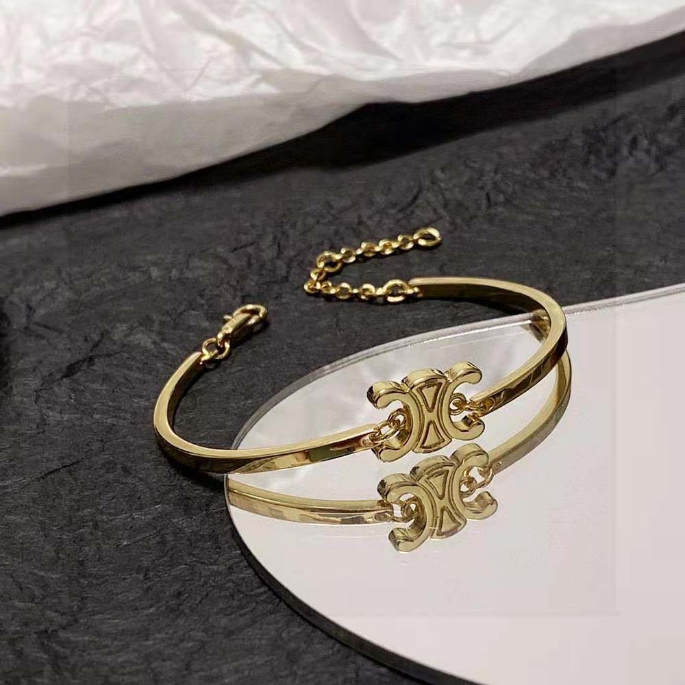 Celine Women Triomphe Articulated Bracelet worn on wrist showcasing signature emblem