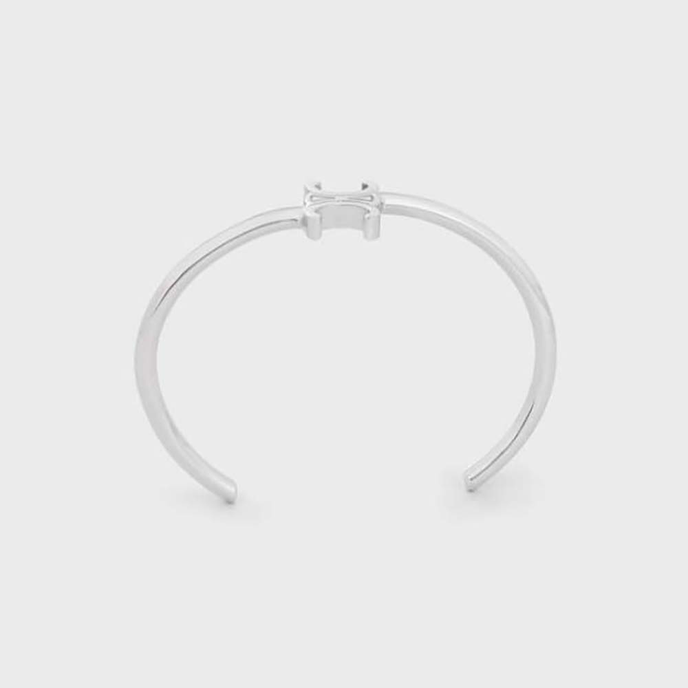 Front view of Celine Women Triomphe Asymmetric Cuff in Brass