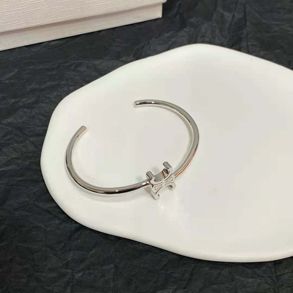 Side angle showing rhodium finish on Celine Triomphe cuff