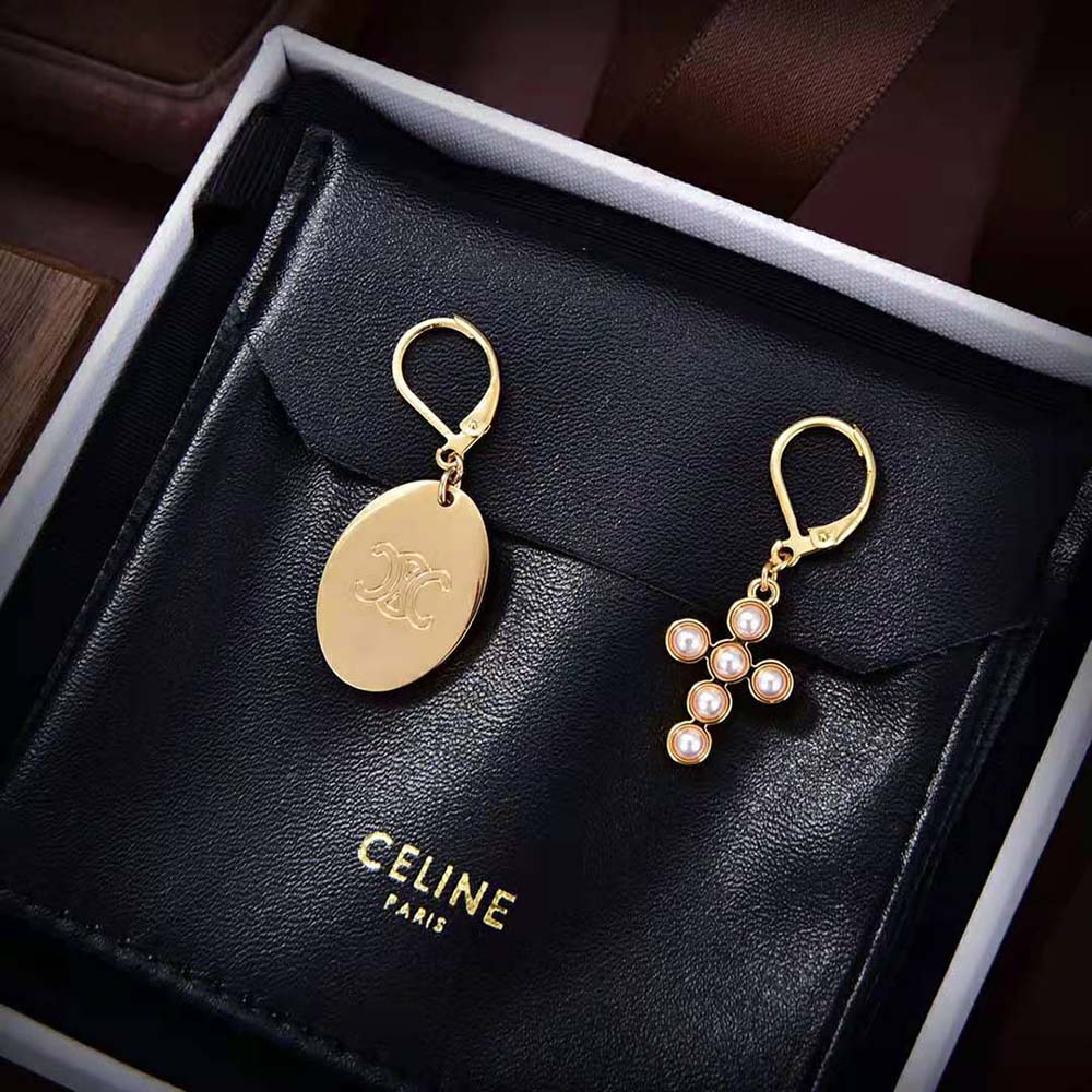 Side view of Celine Women Triomphe Folk Earrings highlighting medium drop silhouette