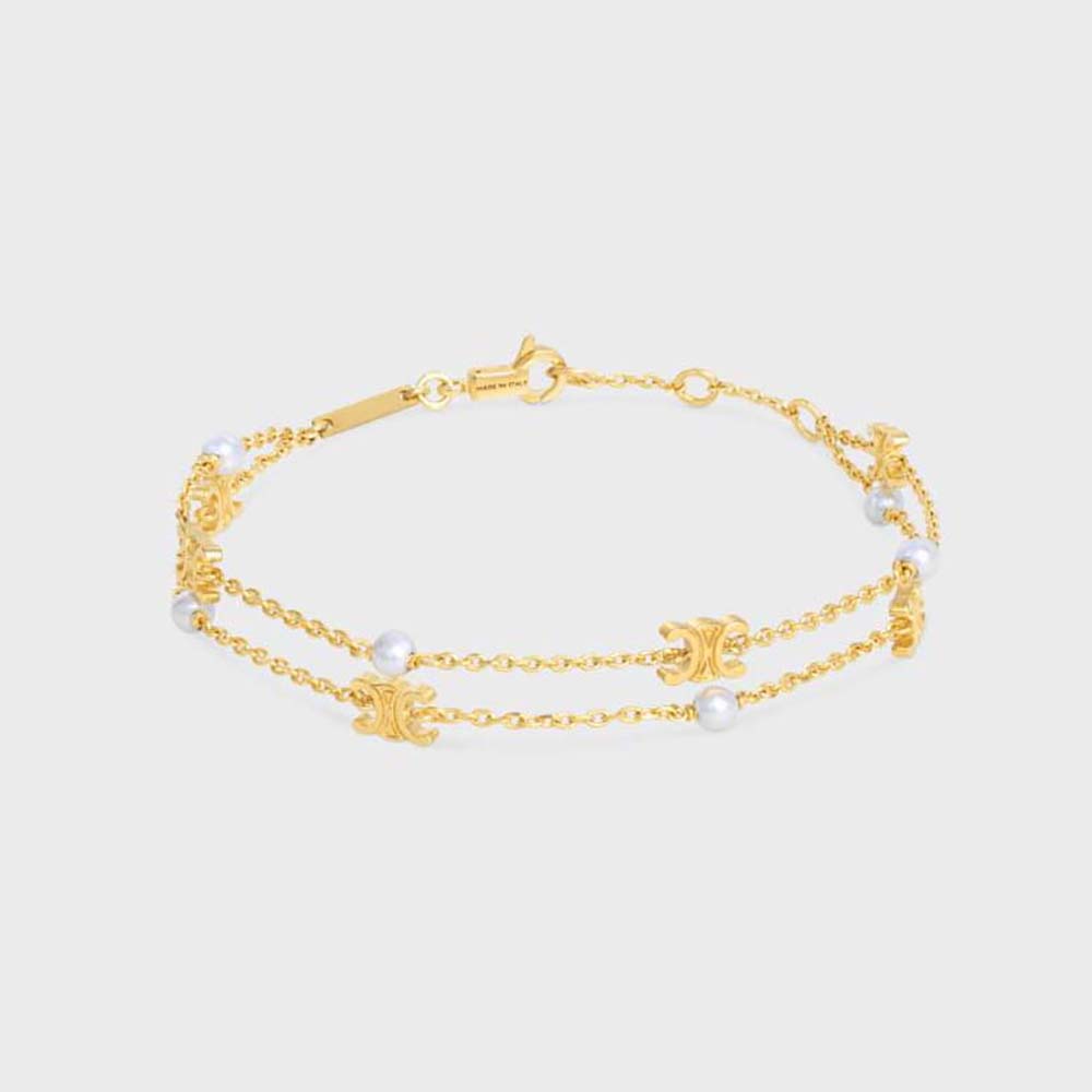 Close-up of Celine Women Triomphe Pearl Double Bracelet gold finish and resin pearls