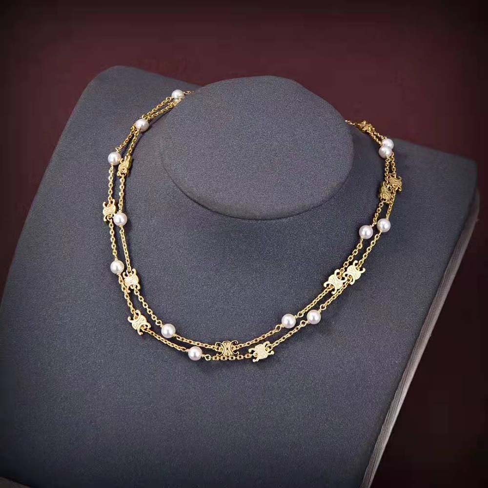 Close-up of resin pearls and brass detailing on Celine necklace