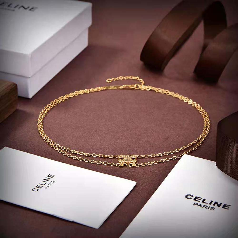 Side angle showing gold clasp and chain texture of Celine Triomphe Necklace