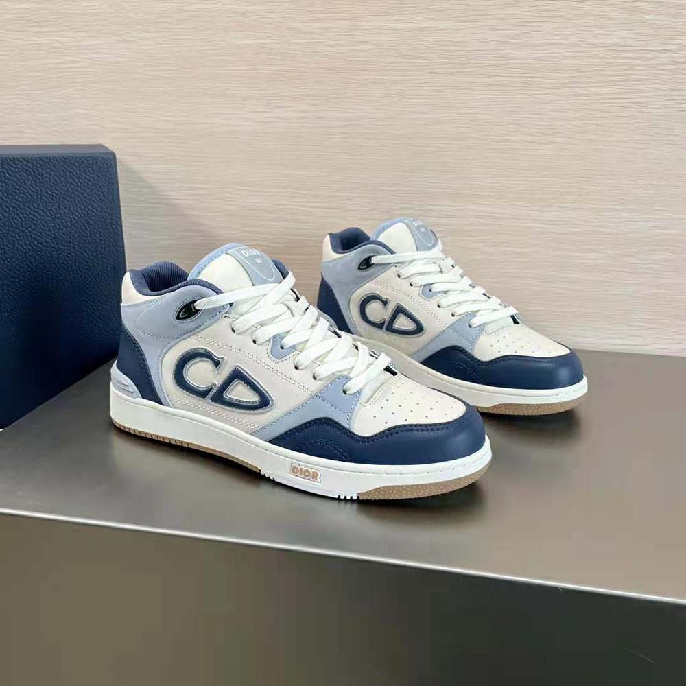 Overhead shot showing cream sole and navy blue detailing of Dior Men B57 sneaker
