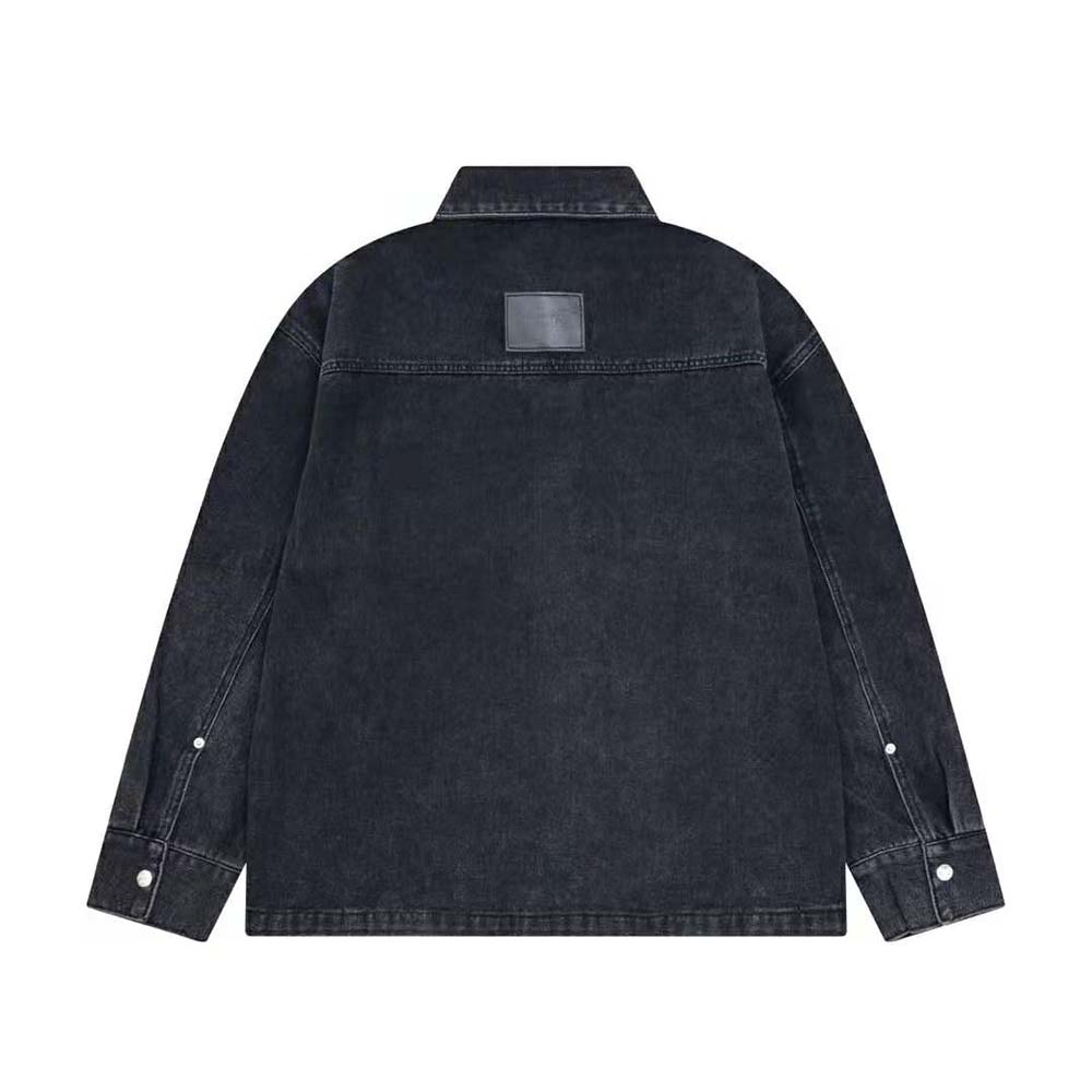 Close-up of Dior metal logo buttons on black cotton twill overshirt