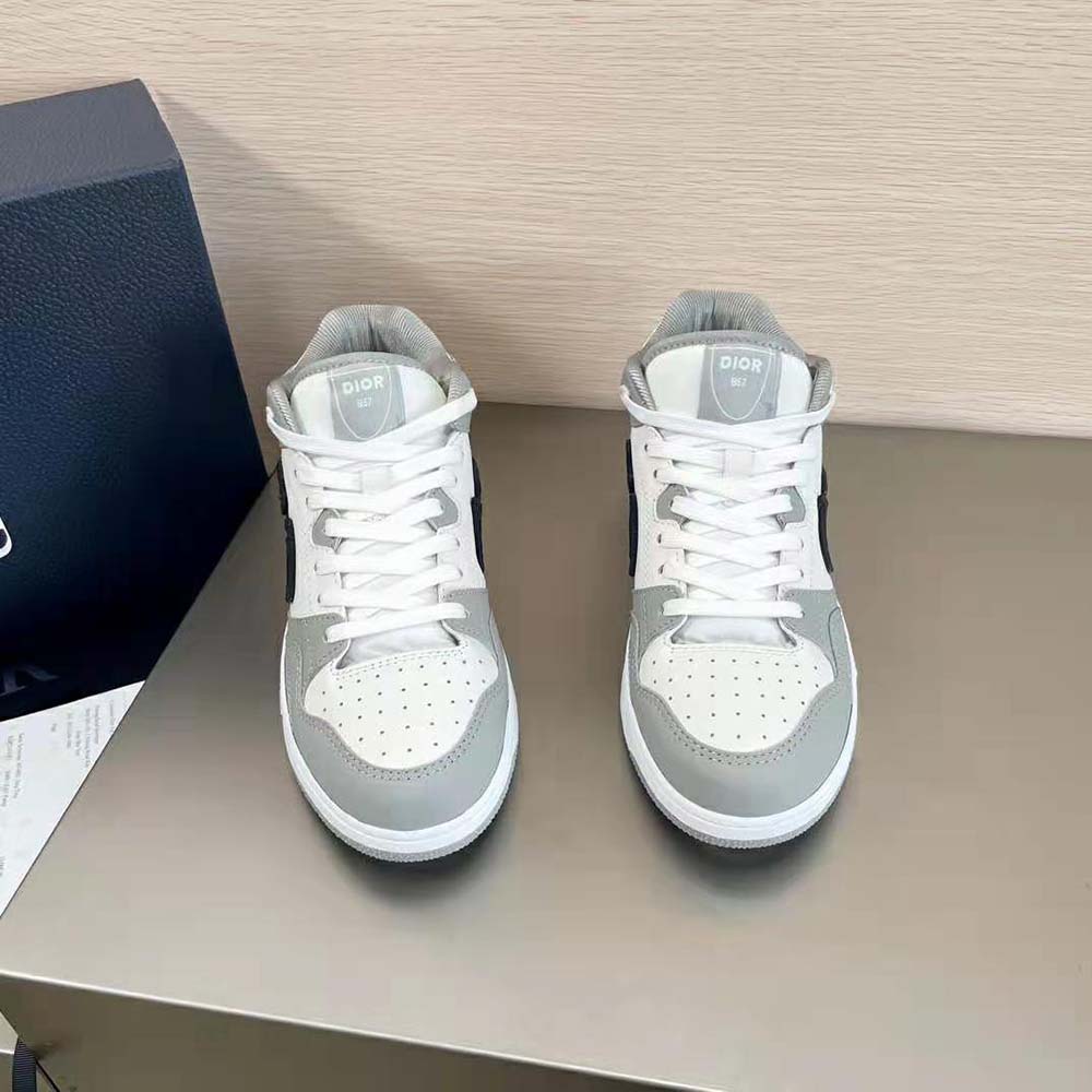 Close-up on silver Dior hardware on Dior Men B57 Mid-Top Sneaker