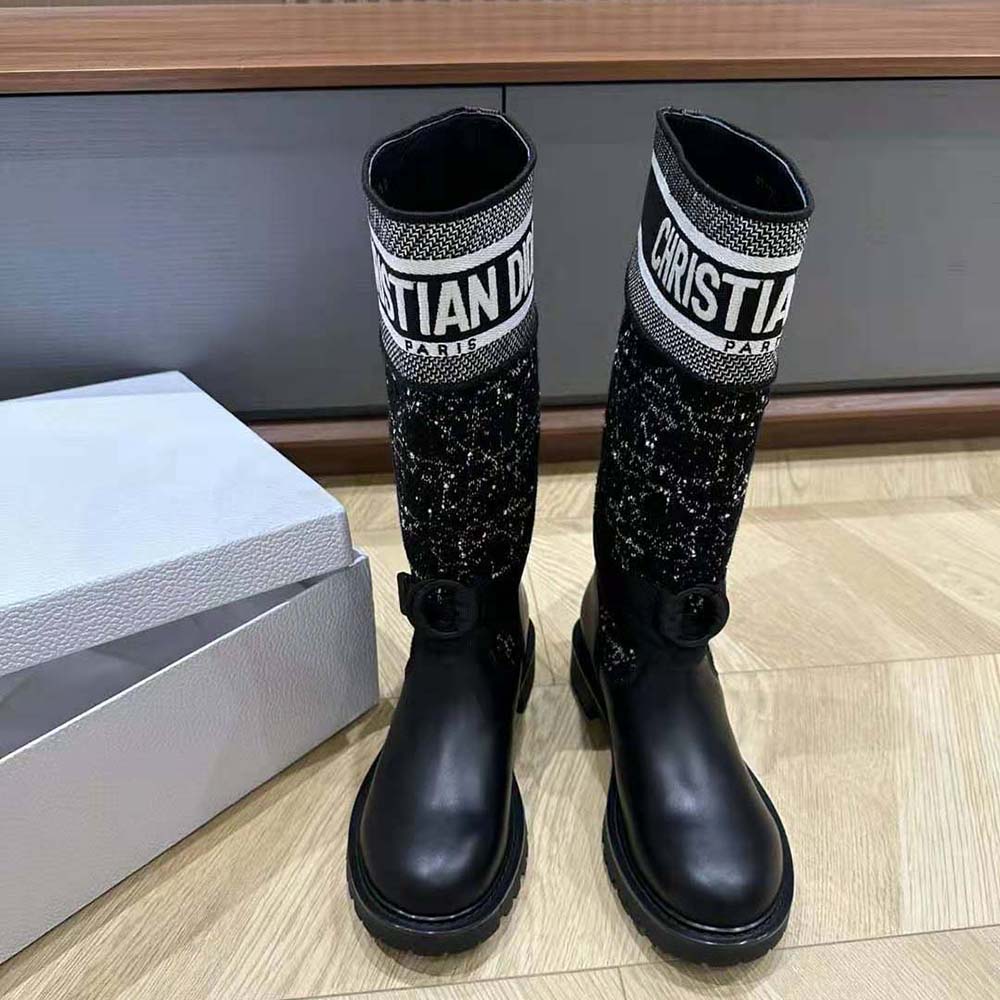 Close-up of black and white Cannage tweed detail on Dior boot