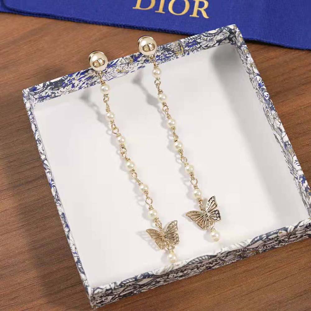 Side angle showing delicate drop silhouette of Dior Women Métamorphose Earrings