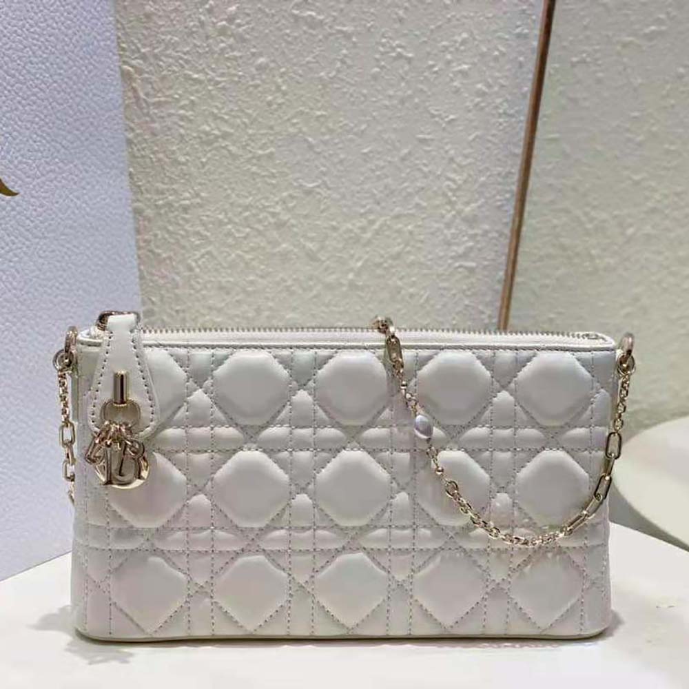 Side angle showcasing flap closure of Dior Women Miss Dior Dior Midi Mini Bag White Cannage Lambskin