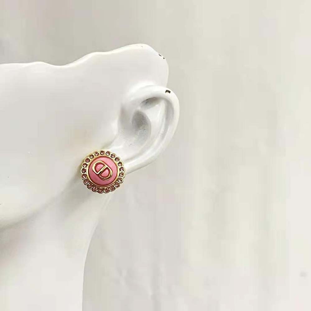 Side angle showcasing gold-finish metal and light pink glass details