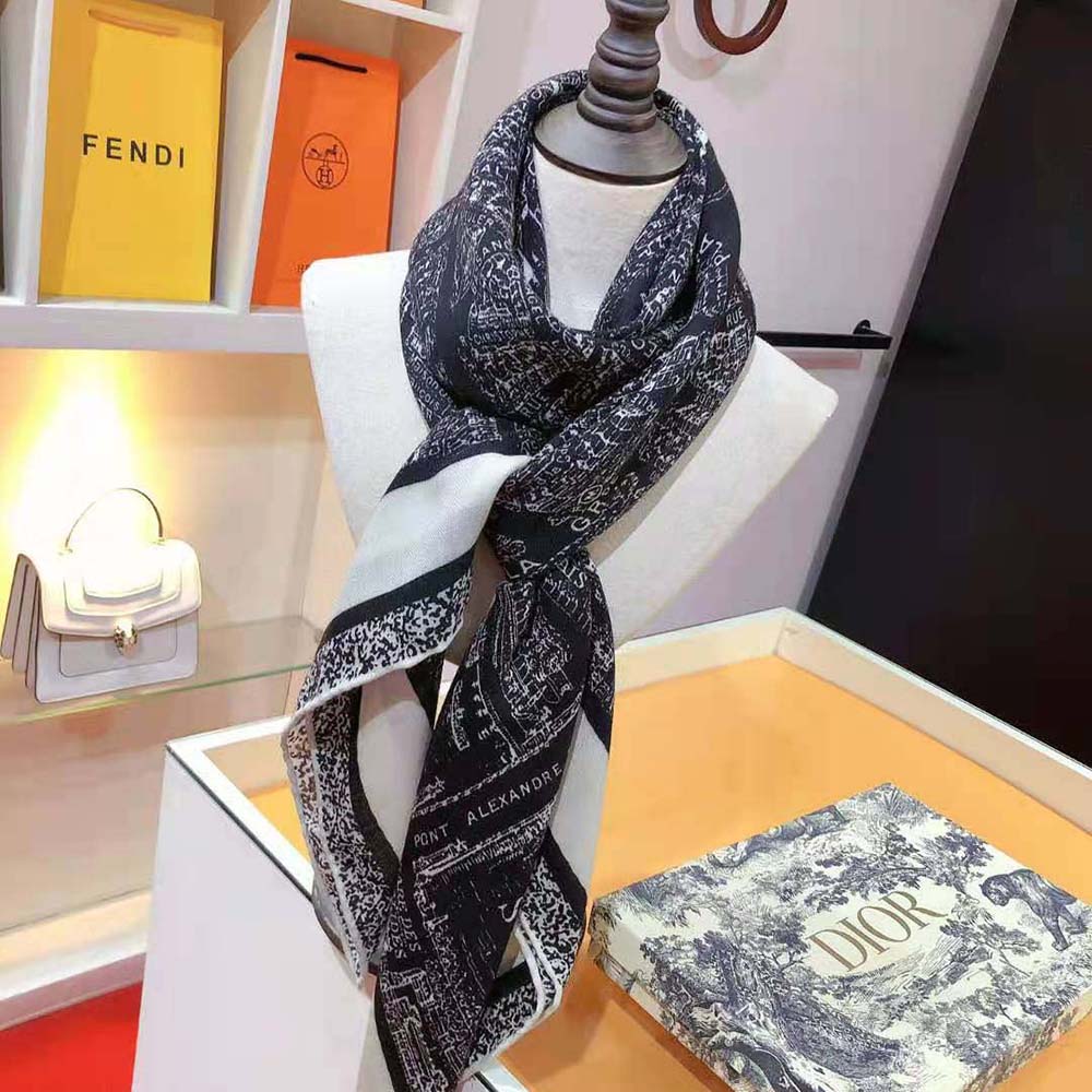 Close-up of silk texture and Dior signature print on scarf corner