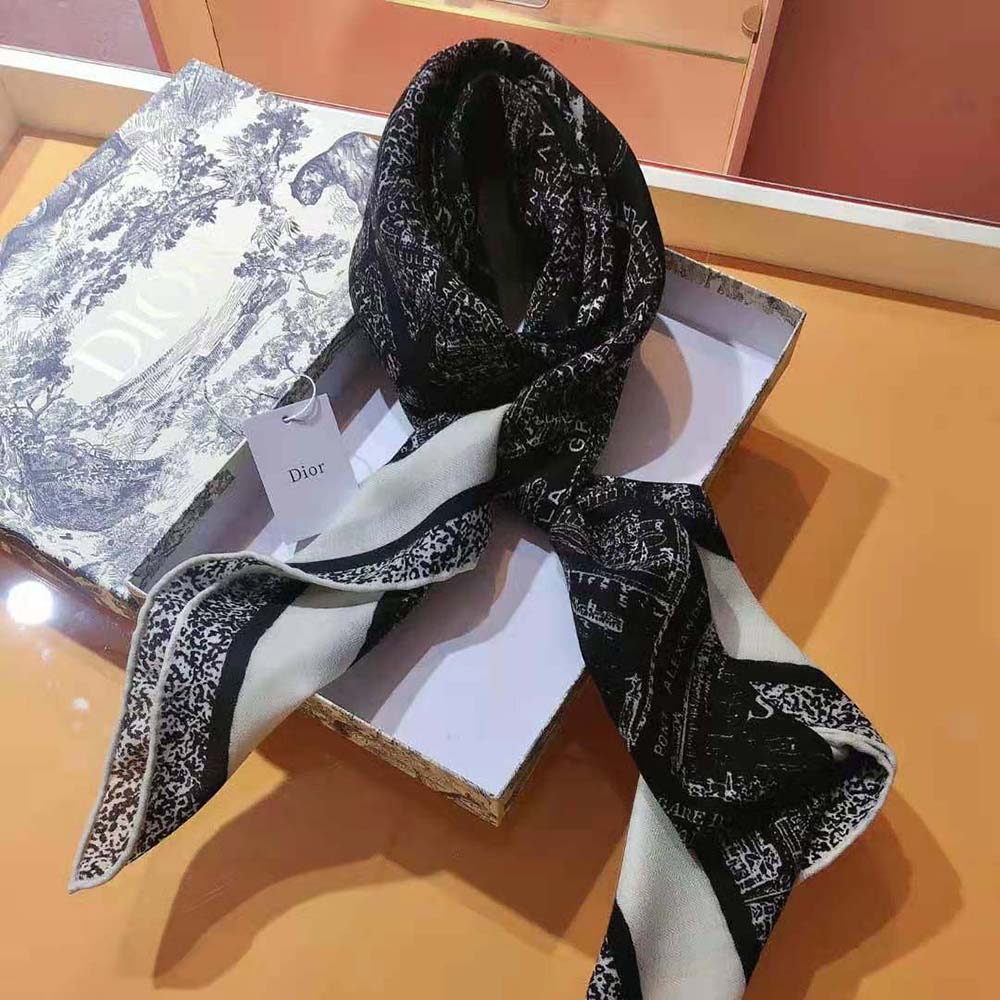 Styled look showing the square scarf tied around neck with black coat