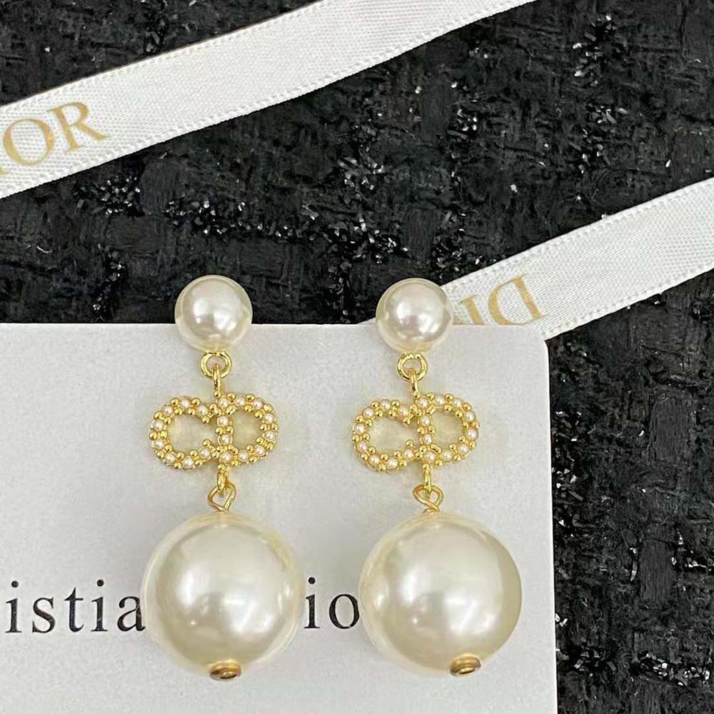 Close-up of white resin pearls and white crystals on Dior Women Tribales Earrings