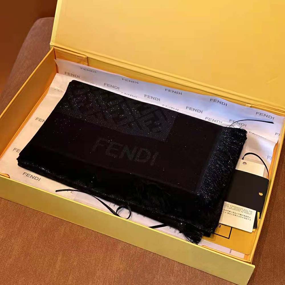 Close-up detail of Fendi FF woven logo on Black Lurex shawl fabric