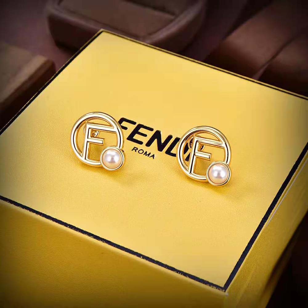 Fendi Women F is Fendi Earrings Gold-colored Metal styled with outfit on model