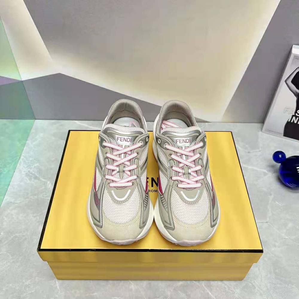 Close-up of beige fabric and Fendi logo hardware on running shoes