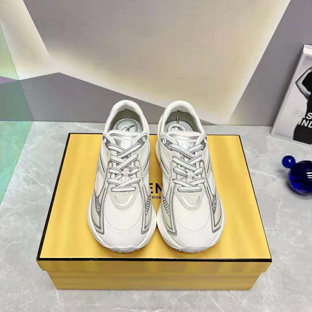 Close-up on signature hardware of Fendi Women First 1 sneakers