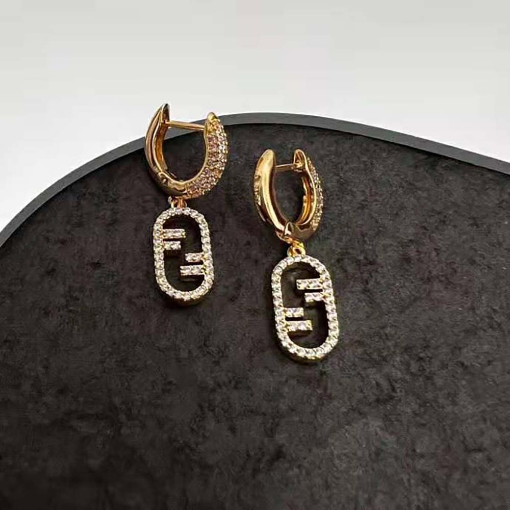 Detailed shot of Fendi O’Lock pendant on Women Hoop Earrings in gold