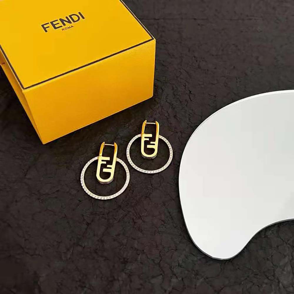 Close-up detail of the polished gold finish on Fendi Women O’Lock Earrings