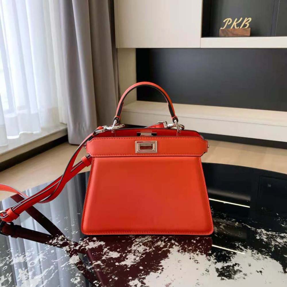 Close-up of signature gold hardware on Fendi Women Peekaboo ISeeU bag