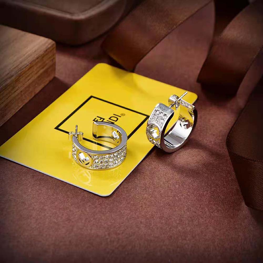 Side angle showing secure closure of Fendi Women Small Hoop Earrings