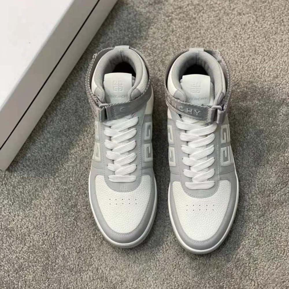 Close-up of embossed Givenchy logo on grey leather sneaker tongue