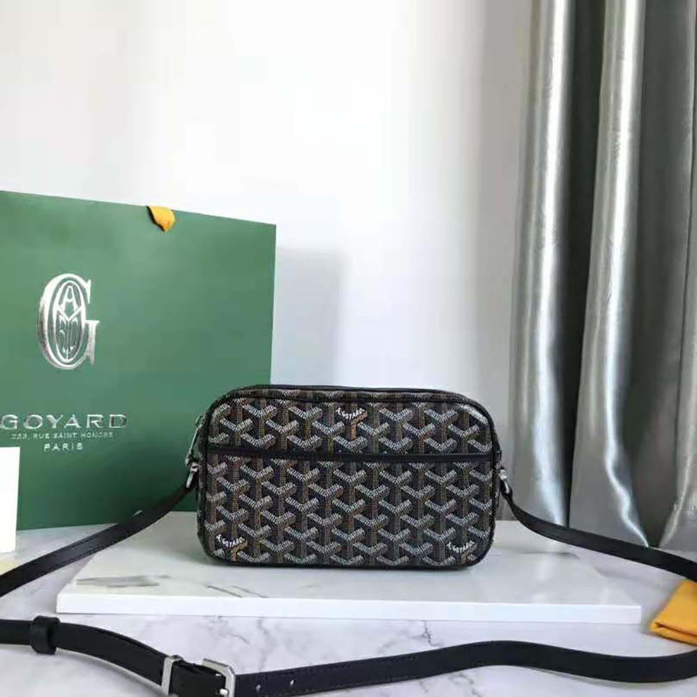 Close-up of black leather trim and brass hardware on Goyard Cap-vert Pm Bag