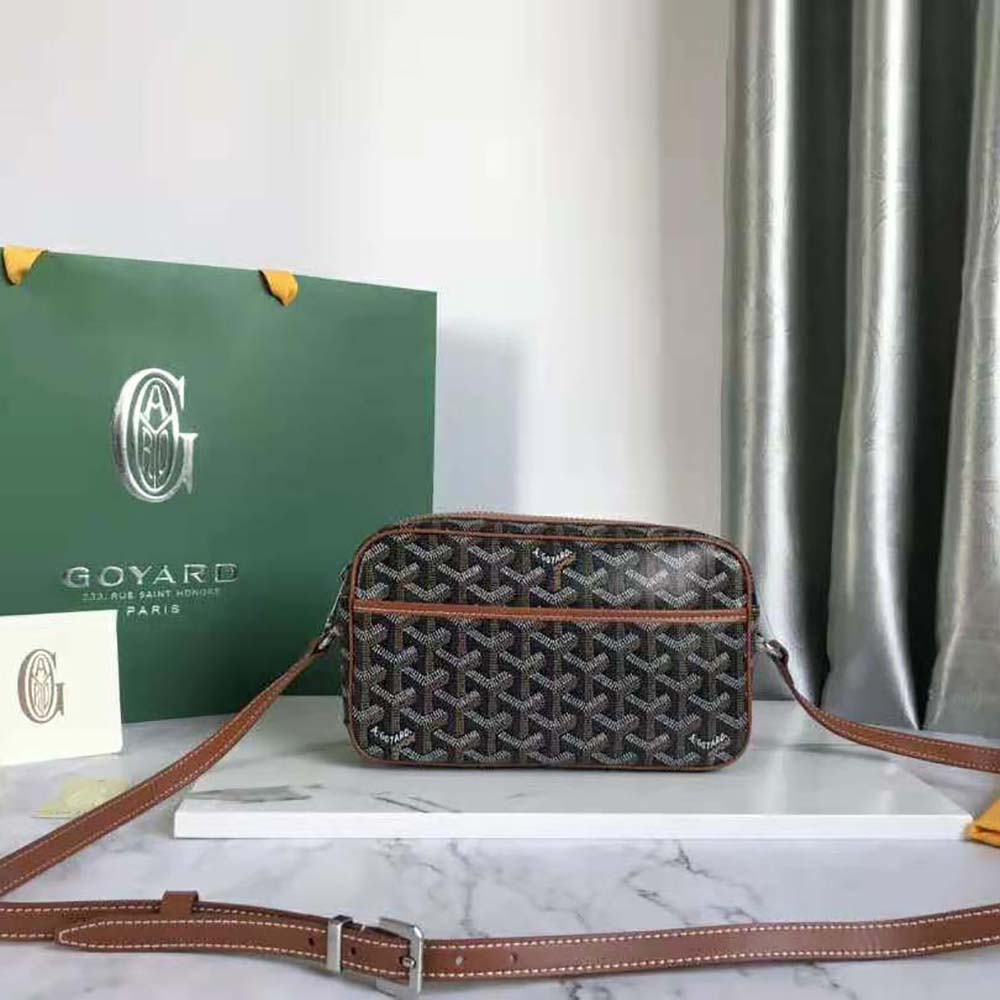 Close-up of brown leather trim and brass hardware on Goyard Cap-vert Pm