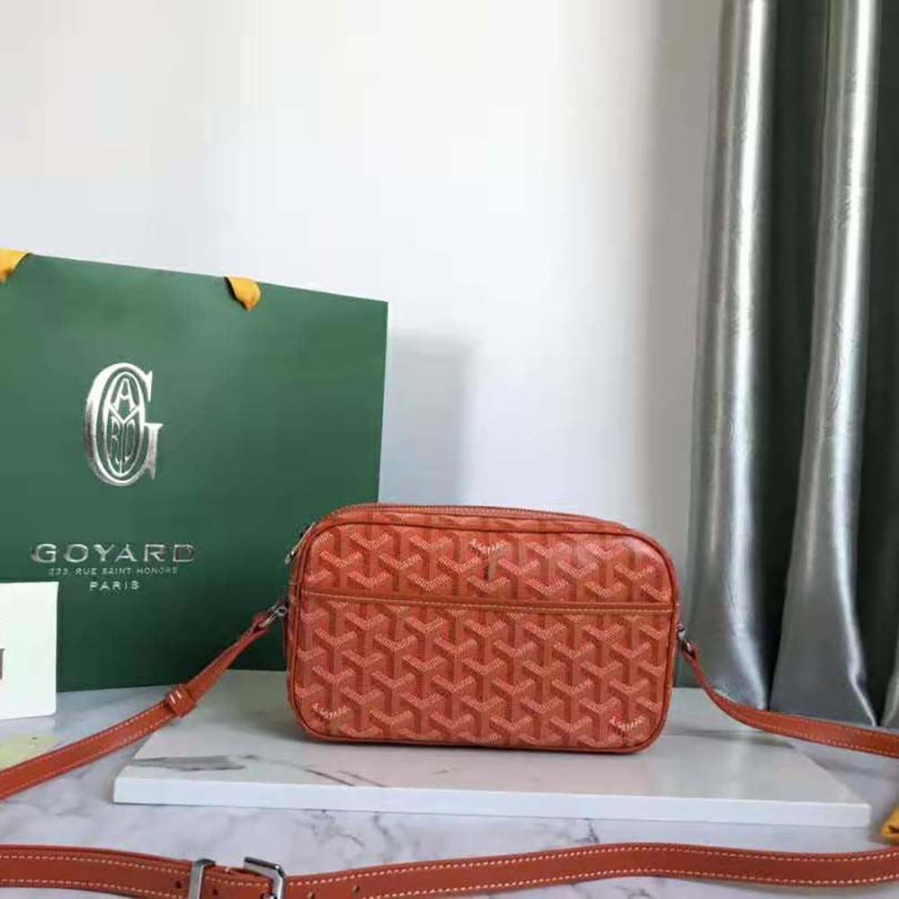 Close-up of Goyard Unisex Cap-vert Pm Bag-Orange brass hardware detail