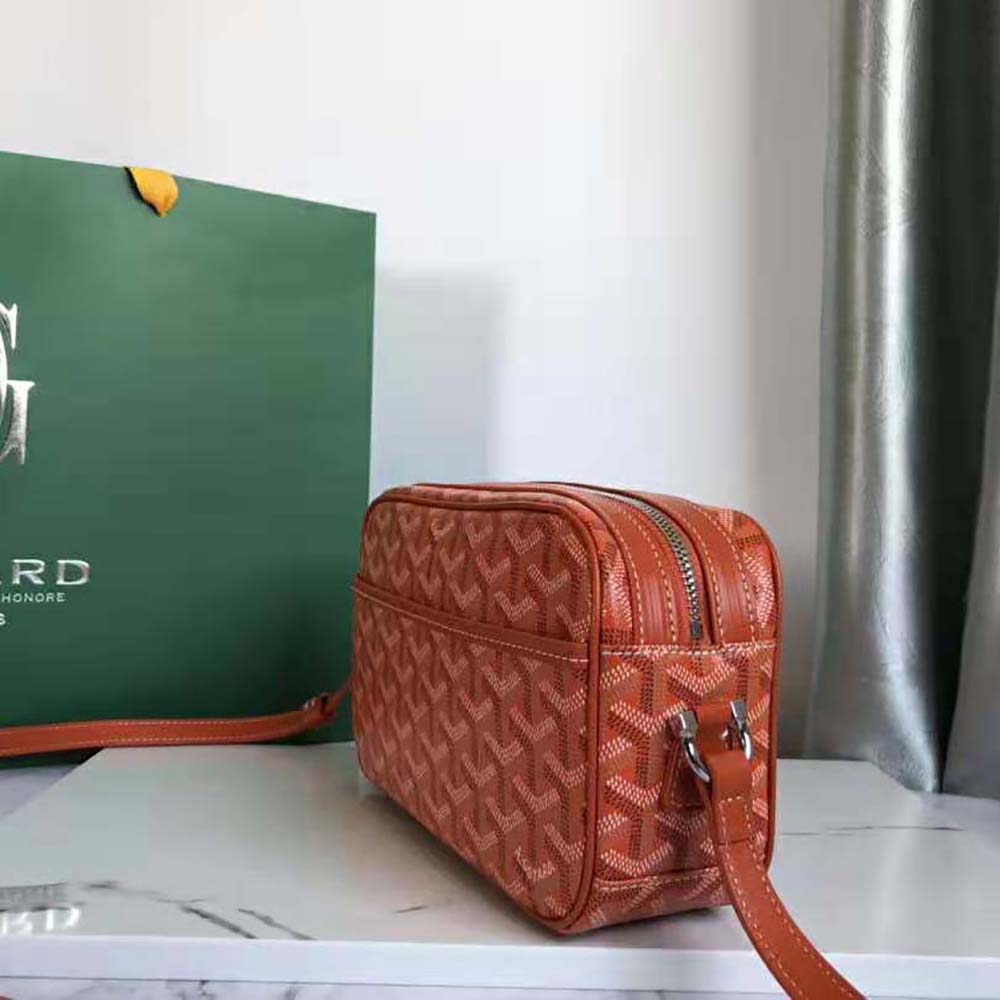 Side angle showing adjustable strap on Goyard Unisex Cap-vert Pm Bag-Orange