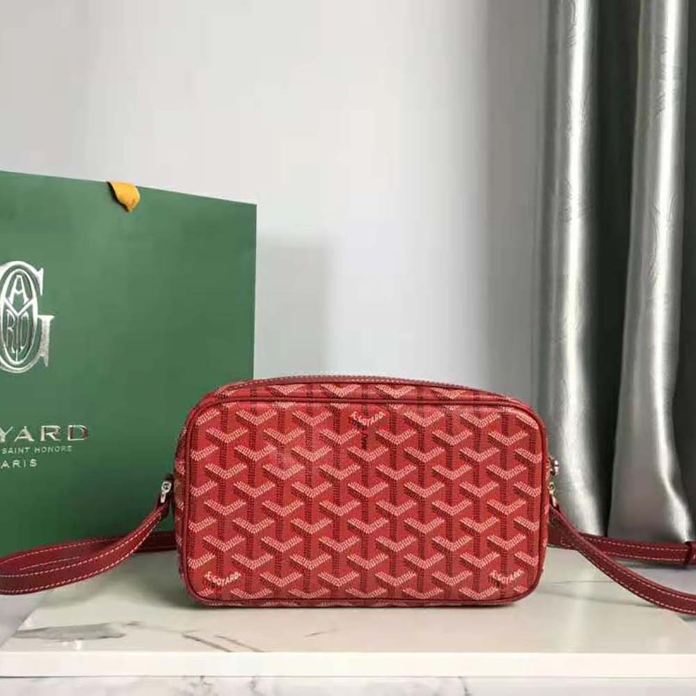 Side angle showing compact silhouette of Goyard Unisex Cap-vert Pm Bag-Red