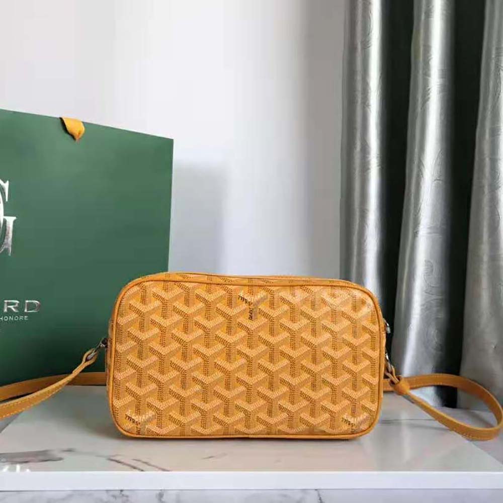 Side profile highlighting compact silhouette of Goyard Unisex Cap-vert Pm Bag-Yellow