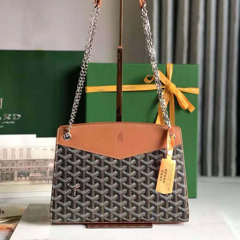 Close-up of Goyardine canvas and signature Chevron pattern on bag