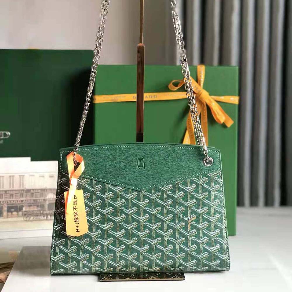 Close-up of green Goyard bag leather trim and brass hardware details