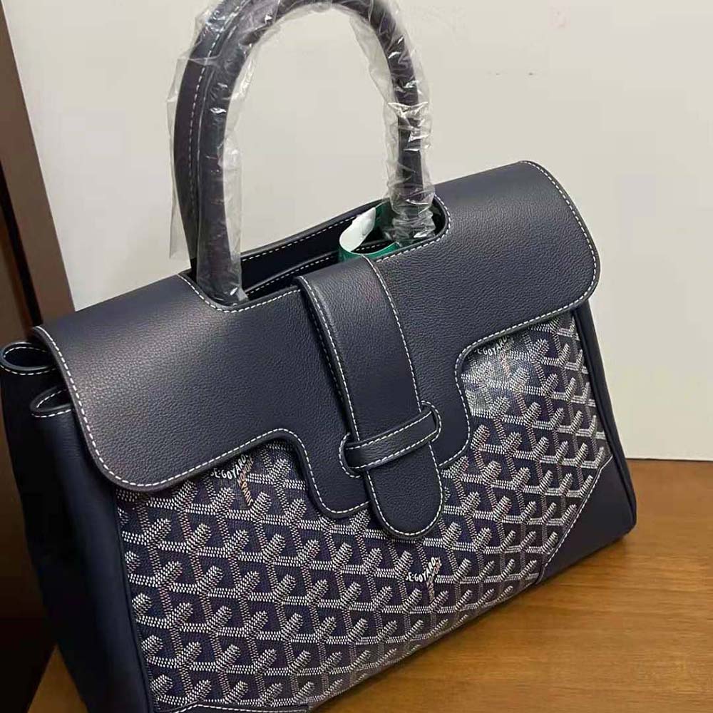 Close-up of brass hardware and leather trim on Goyard Saïgon Tote