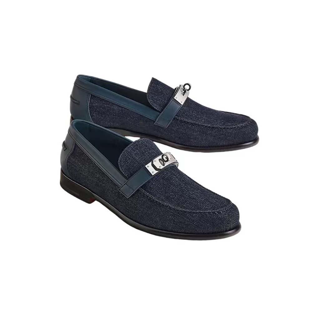 Close-up on Hermes signature hardware detail on loafer vamp