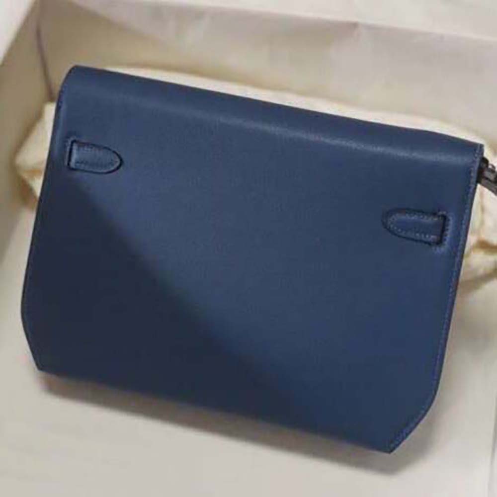 Side angle of Hermes Men Kelly Depeches 25 Pouch-Navy highlighting slim profile