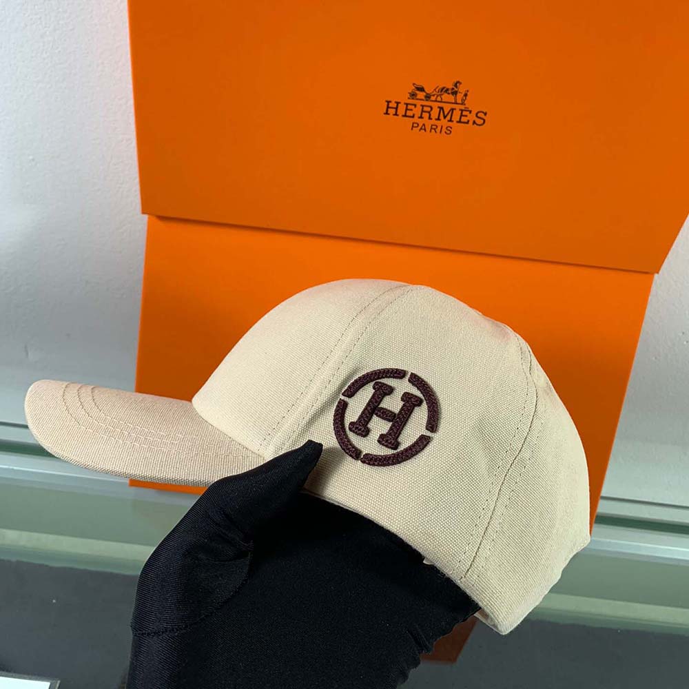 Side angle showing stretch cotton texture on Hermes Men Miles H Circle Cap