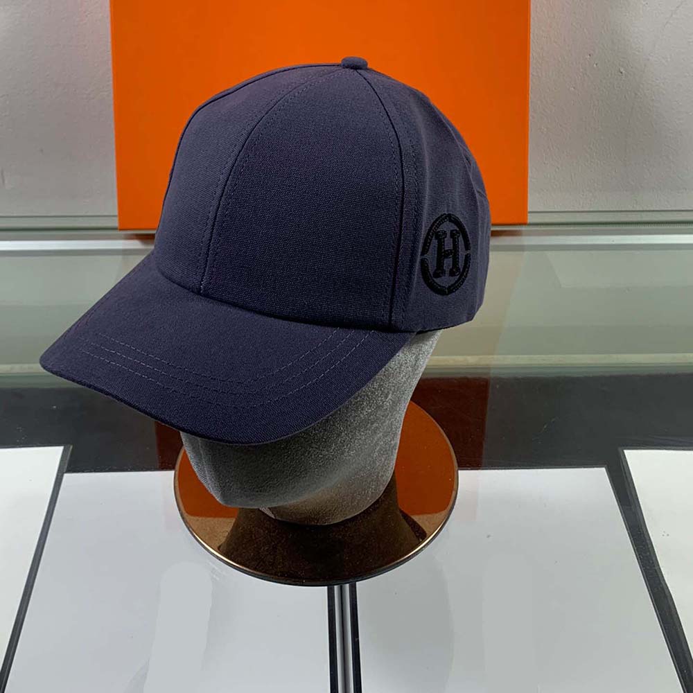 Front view of Hermes Men Miles H Circle Cap in Navy showing logo