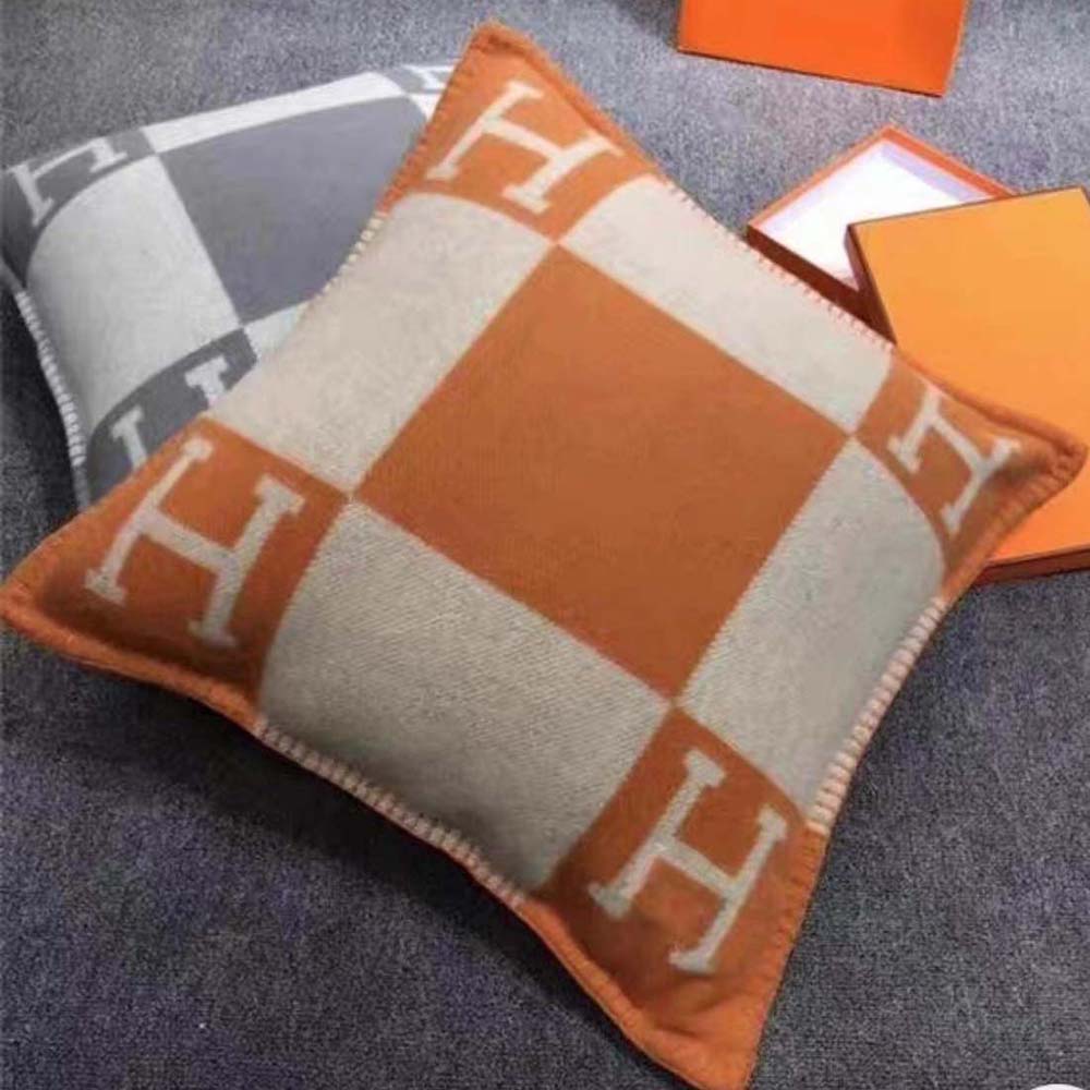 Side angle highlighting leather texture and plush silhouette of Avalon Pillow Large Model-Orange