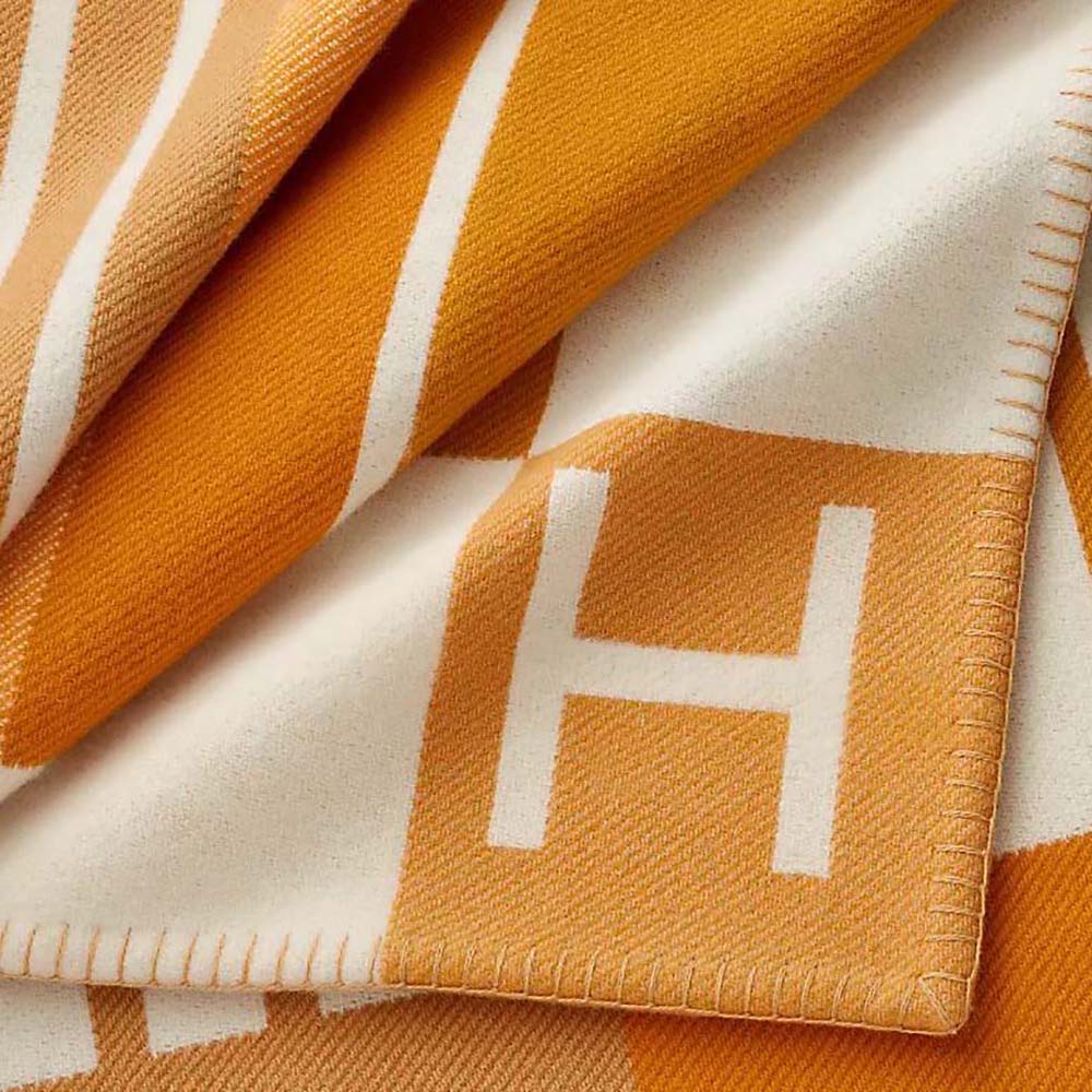Close-up on jacquard vibration pattern of Hermes Unisex Avalon Vibration Throw Blanket-Orange