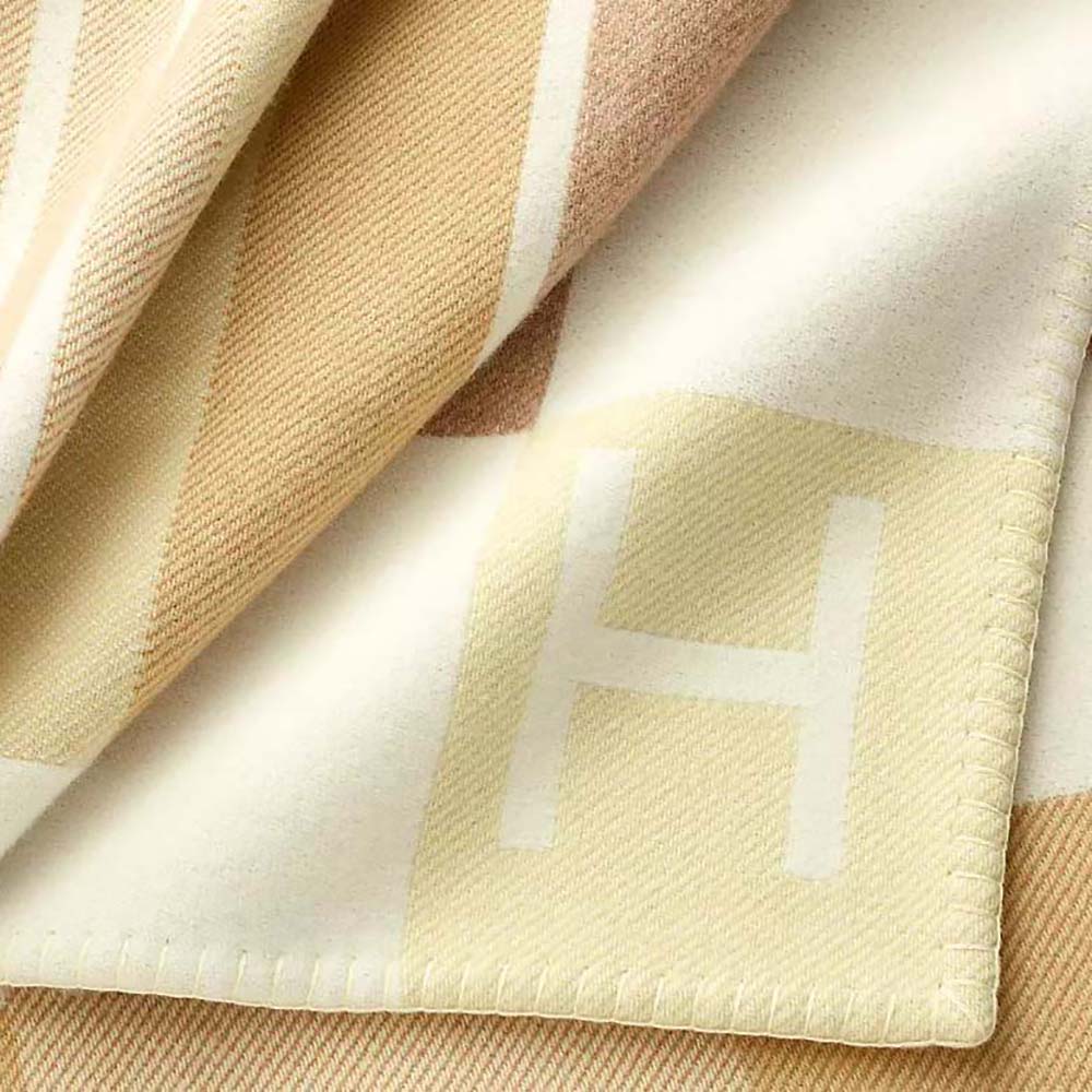 Hermes Unisex Avalon Vibration Throw Blanket-Yellow draped over sofa