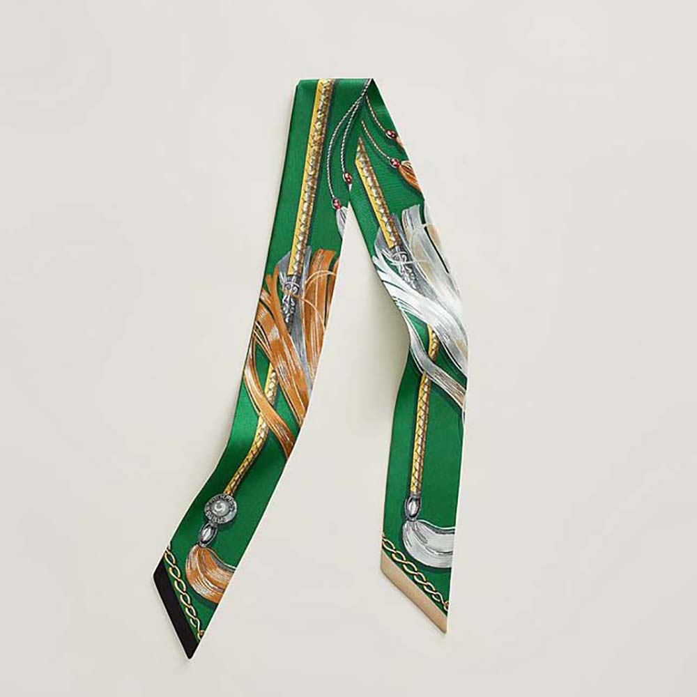 Close-up of Hermes Women Cavalcades Twilly-Green silk texture and print