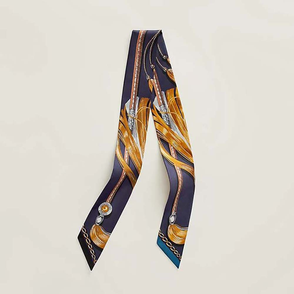 Close-up of Hermes Women Cavalcades Twilly-Navy silk texture and print