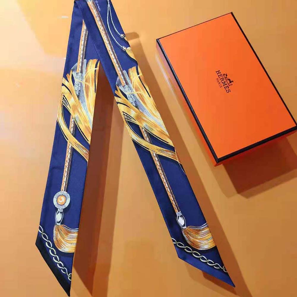 Side view of Hermes Women Cavalcades Twilly-Navy tied as a neck scarf