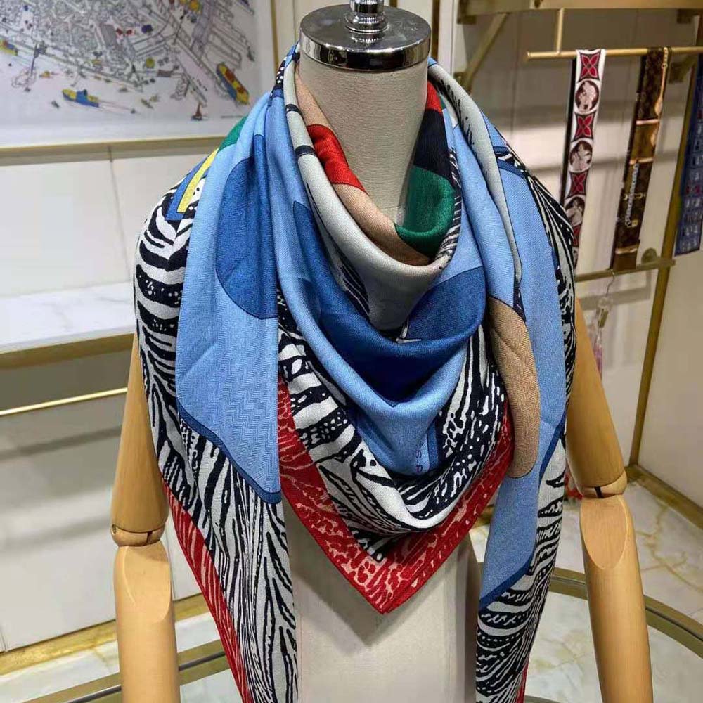 Close-up of Hermes Women Cavalier En Formes Scarf 90-Blue silk texture
